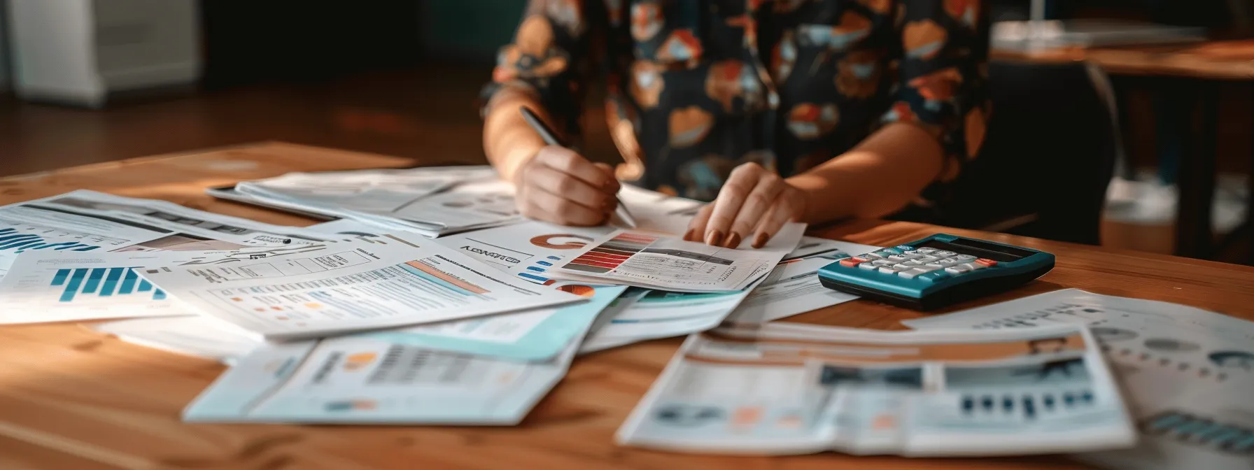 a person carefully comparing different final expense insurance policies with a focused expression, surrounded by informational brochures and a calculator on a wooden desk.